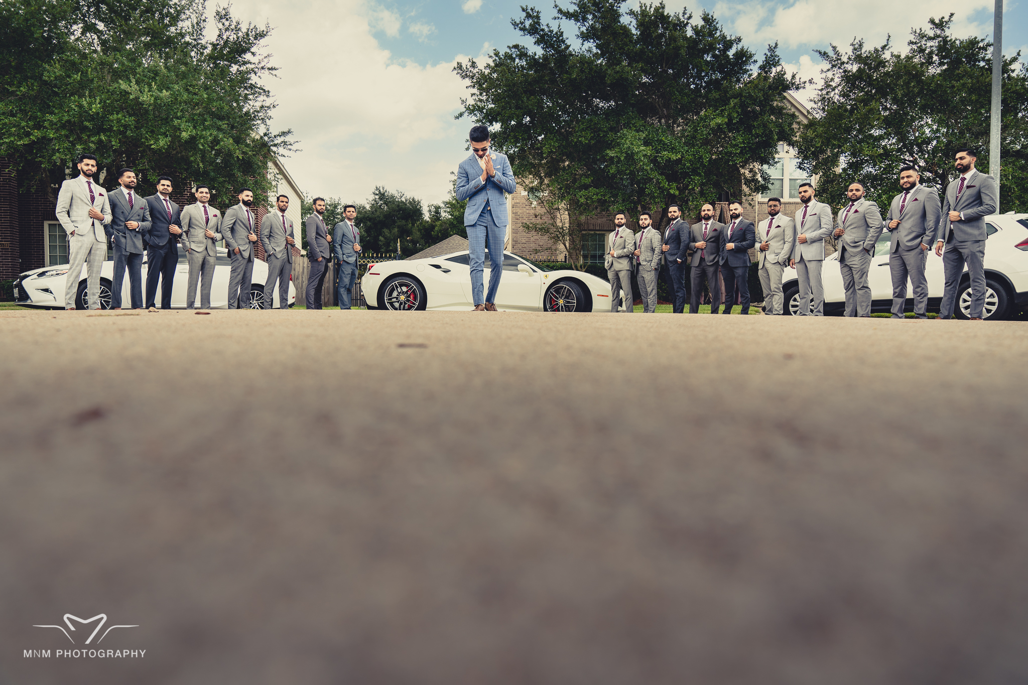 Groomsmen help with wedding ring selection - MnM Photography