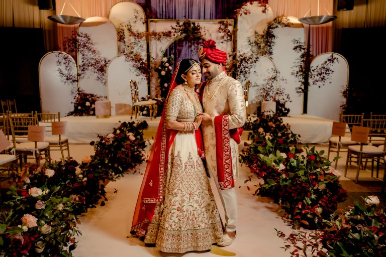 Indian wedding couple with mandap decor