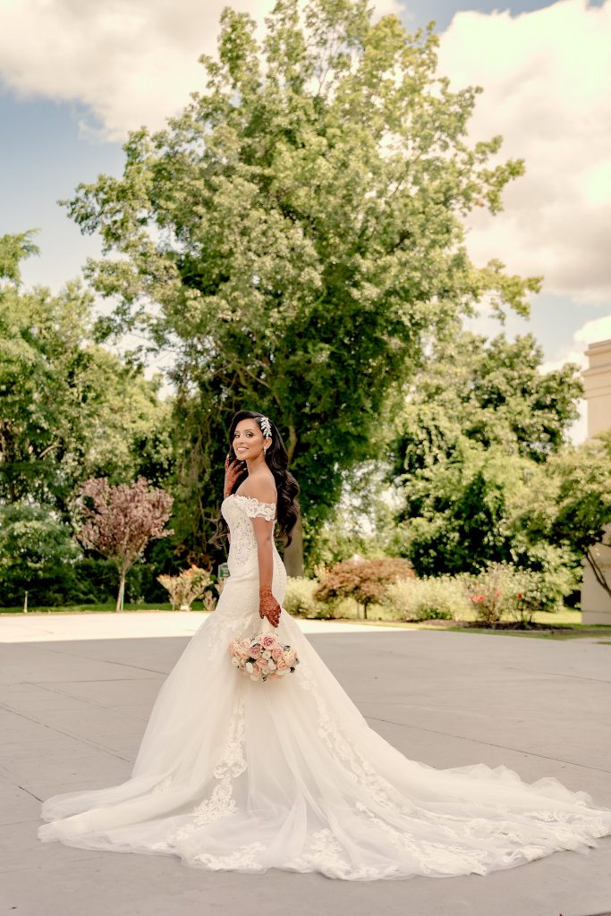 bridal gown white dress long train and flower bouquet 