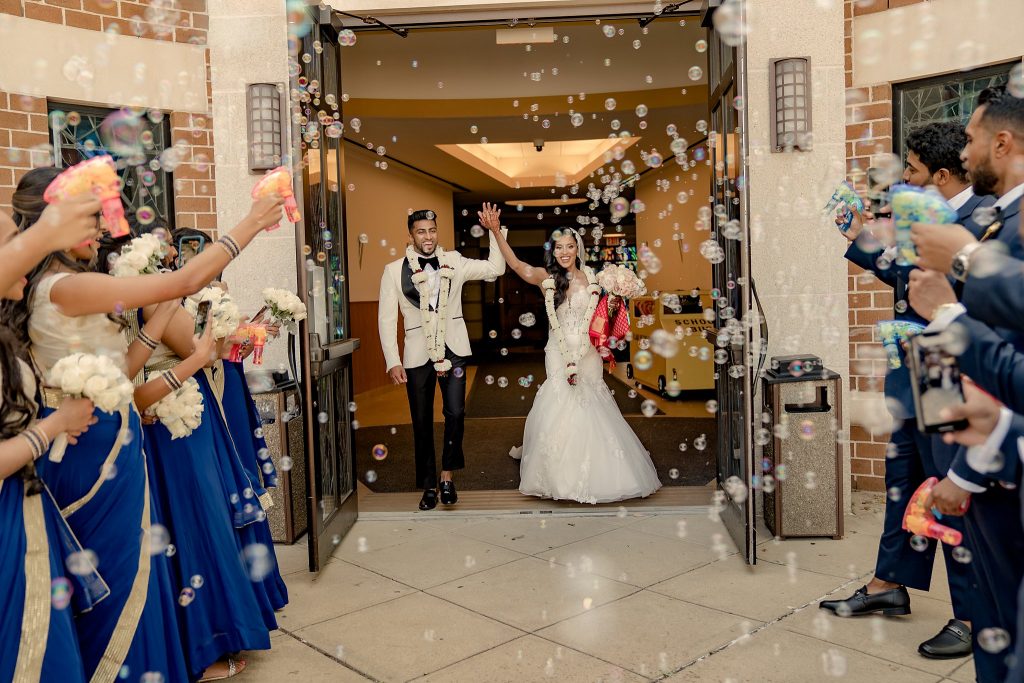 bride and groom exit with bubbles